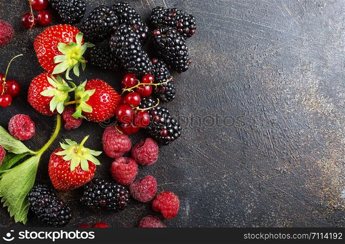 Background of fresh fruits and berries. Ripe blackberries
