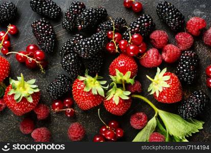 Background of fresh fruits and berries. Ripe blackberries