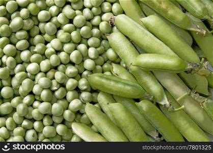 Background of Fresh ripe green peas and pods