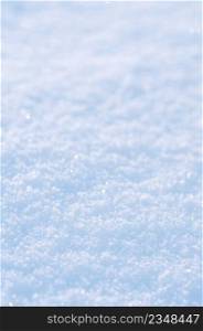 Background of fresh snow. Natural winter background. Snow texture in blue tone. Snow winter background