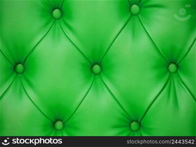Background of green leather furniture upholstery. Chesterfield Style. Background of green leather furniture upholstery