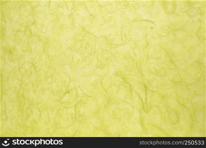 background of green textured handmade mulberry paper