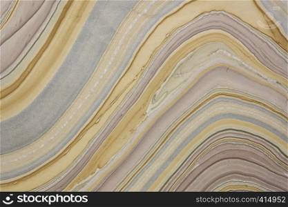 background of handmade Thai marbled mulberry paper with flowing pattern