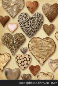 Background of heart-shaped things made of wood on vintage paper background.&#xA;