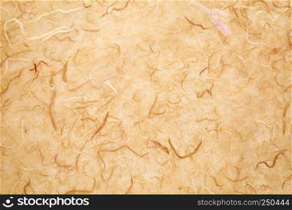background of light brown textured handmade mulberry paper