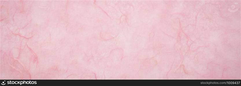 background of light pink, textured, handmade mulberry paper, long banner format