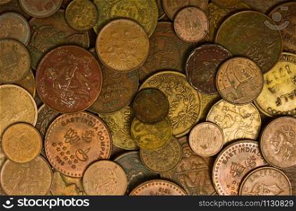 background of many coins of different times and countries. old money coins