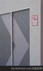 Background of No smoking sign on gray wall decoration in public area and vertical frame