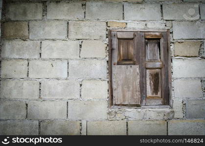 background of old brick wall with vintage window