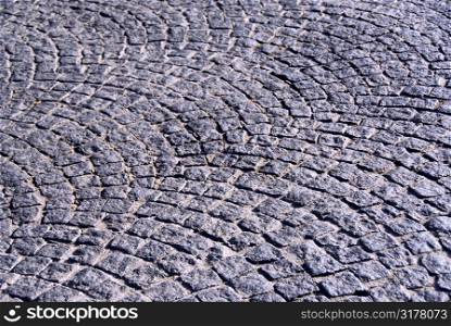 Background of old cobble stone granite pavement