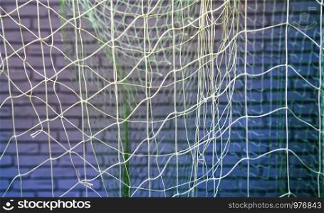 background of old fishing nets hung to dry. fish net bacground