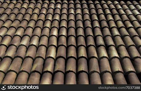 Background of old roof tiles made of colorful clay