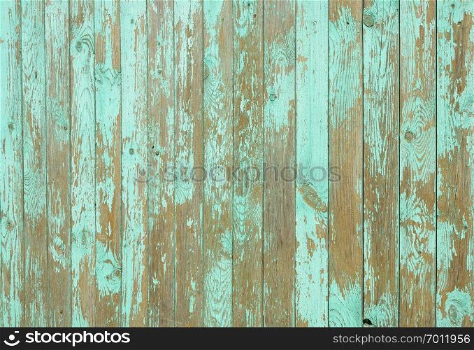 Background of old weathered green painted wooden fence