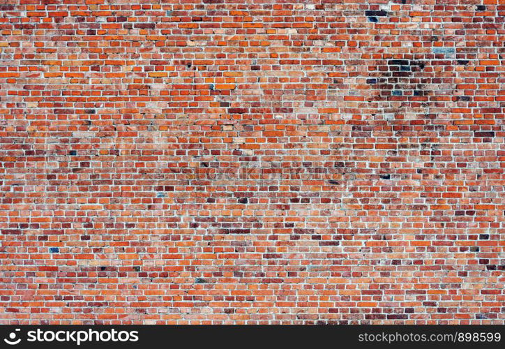 Background of old weathered red brick wall