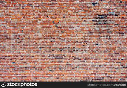Background of old weathered red brick wall