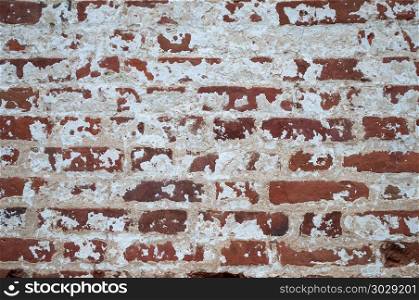 Background of old weathered red brick wall. Old vintage brick wall background