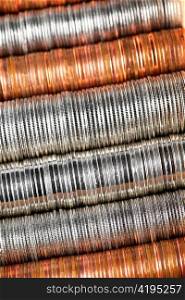Background of penny nickel dime and quarter stacked coins