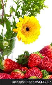 background of red big juicy ripe strawberries and flower