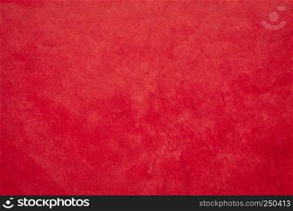 background of red, textured, handmade mulberry paper