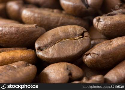 background of roasted coffee beans with shallow dof