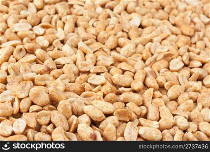 Background of roasted peanuts with shallow depth of field.