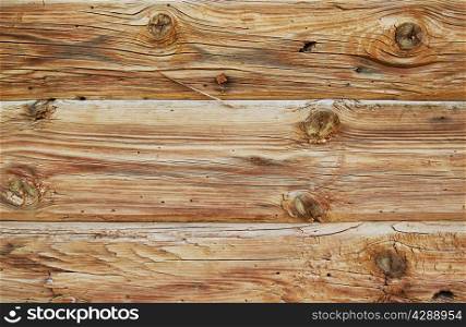Background of rough wooden boards with different knots