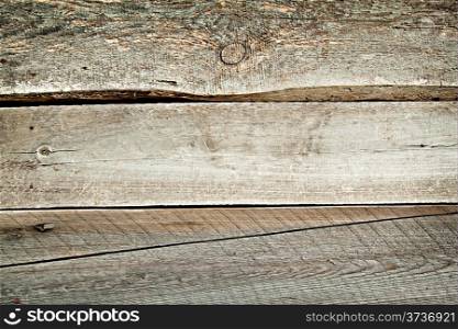 Background of rough wooden planks with knots of dark
