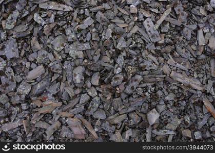 Background of small sharp stones covered with lichen in tundra