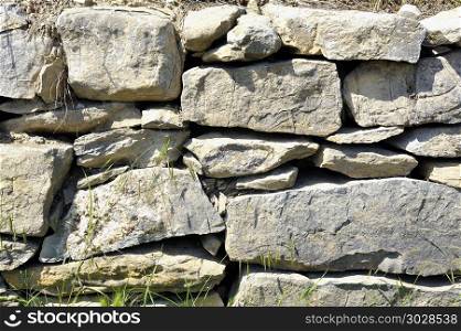background of stacked and uncemented stone wall