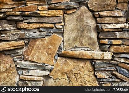 Background of stone wall with rough stones