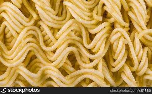 Background of tasty yellow instant noodles