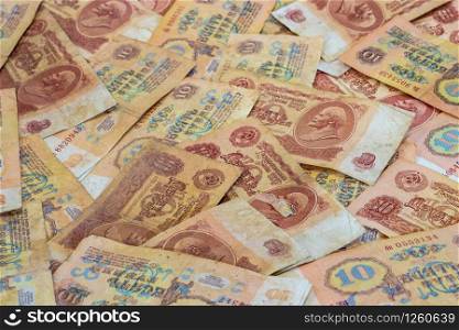 Background of ten ruble denominations of Soviet money of the 1961 sample, shot in close-up.