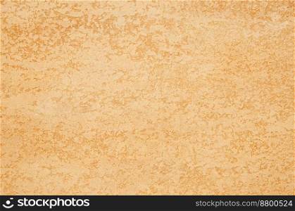 background of textured plaster of golden color. art background. plaster background
