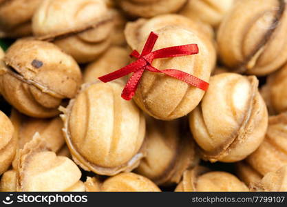 background of the cake in the shape of nut and ribbon