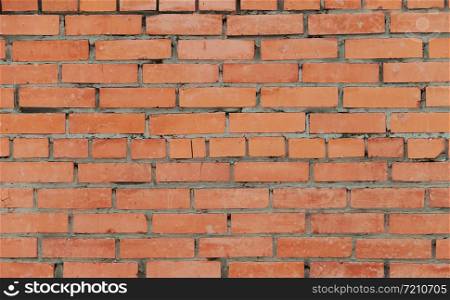 Background of the dark orange brick wall. May be used as a backdrop in interior design