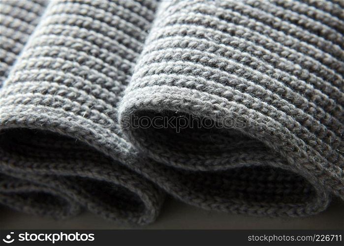 Background of the knitted fabric in the fold. Background of the knitted fabric