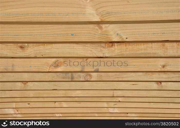 background of timber purloins on large building
