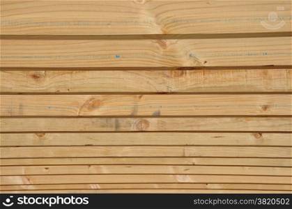 background of timber purloins on large building