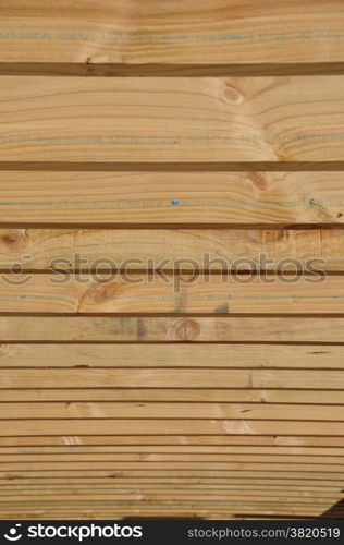 background of timber purloins on large building