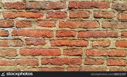 Background of very old red brick wall, close-up ancient texture