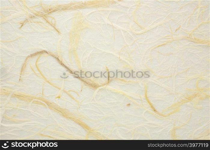 background of warm, golden wheat tone and bird&rsquo;s nest texture Thai paper with straw inclusions
