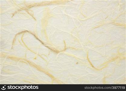 background of warm, golden wheat tone and bird&rsquo;s nest texture Thai paper with straw inclusions