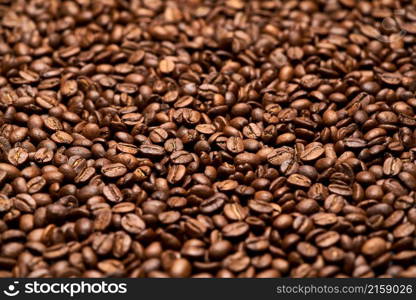 Background or texture made of roasted brown coffee beans.. Background or texture made of roasted brown coffee beans