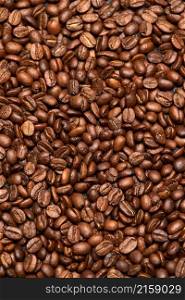 Background or texture made of roasted brown coffee beans.. Background or texture made of roasted brown coffee beans