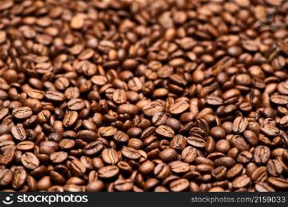 Background or texture made of roasted brown coffee beans.. Background or texture made of roasted brown coffee beans