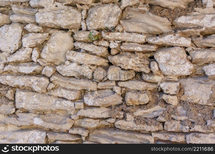 Background or texture of old vintage stone wall. Background of old vintage stone wall