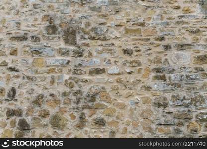 Background or texture of old vintage stone wall. Background of old vintage stone wall
