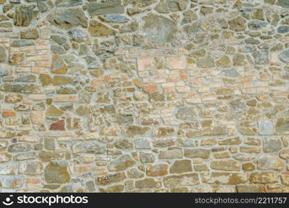 Background or texture of old vintage stone wall. Background of old vintage stone wall