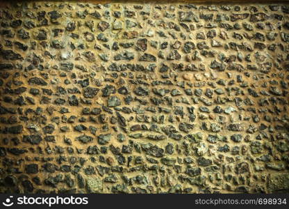 Background or texture pattern brown color of style design decorative uneven cracked stone wall surface with cement