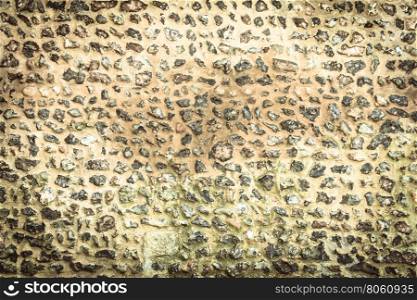 Background or texture pattern brown color of style design decorative uneven cracked stone wall surface with cement